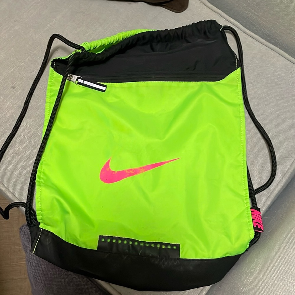 Nike neon green with pink emblem drawstring backpack. Front zipper-unisex